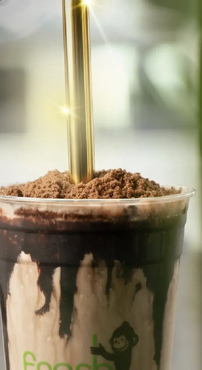 Fresh Monkee chocolate shake with a golden straw